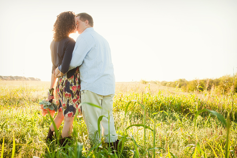 romantic and fun engagement portraits by a hay bail by Allison Davis photograph