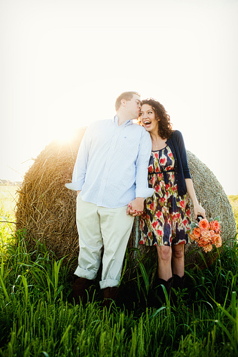 romantic and fun engagement portraits by a hay bail by Allison Davis photograph