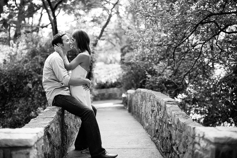 engagement portraits on a bridge at Turtle Creek Park in Highland park by Dallas wedding photographer Allison Davis