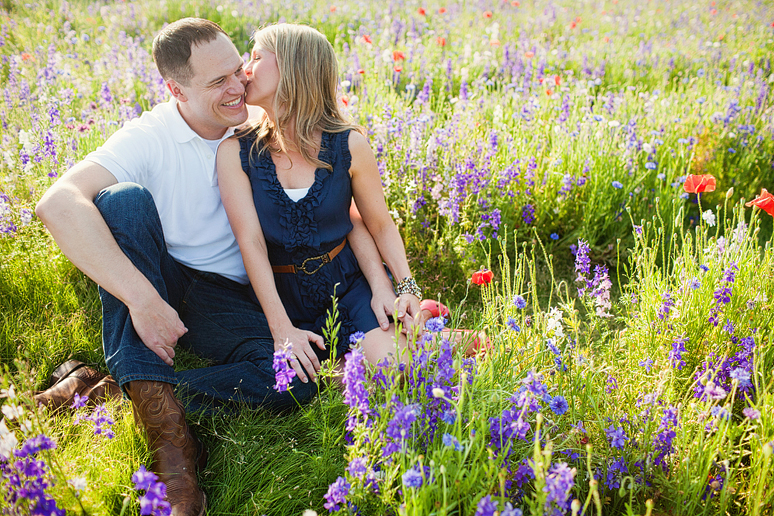 Romantic engagement portraits at Prairie Creek Park by Frisco wedding photographer Allison Davis Photography in a wild flower field