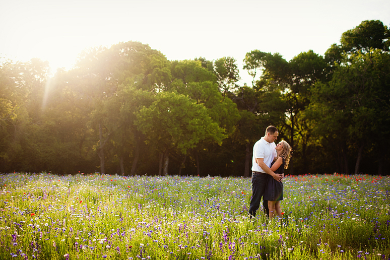 Romantic engagement portraits at Prairie Creek Park by Plano wedding photographer Allison Davis Photography in a wild flower field