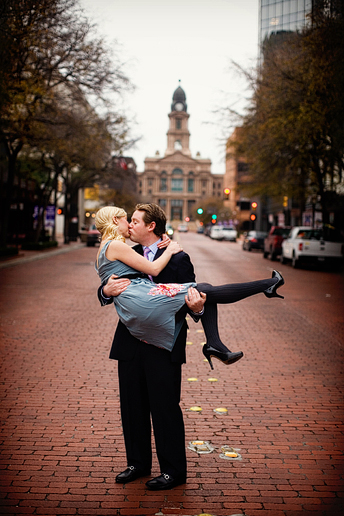 engagement portraits in downtown fort worth with the courthouse in the back