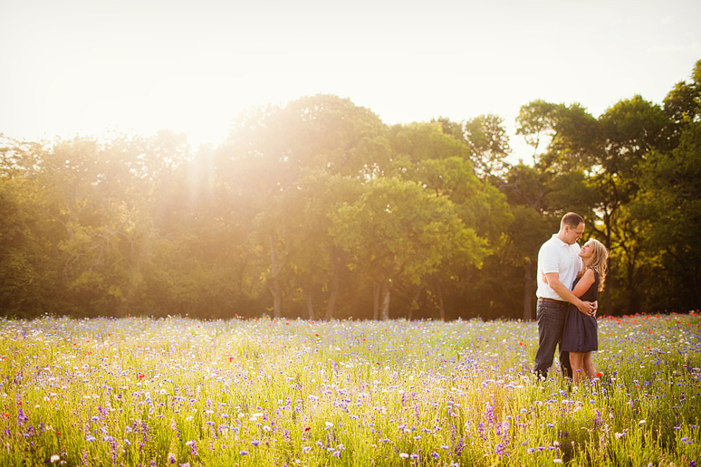 Romantic engagement portraits at Prairie Creek Park by Dallas wedding photographer Allison Davis Photography in a wild flower field