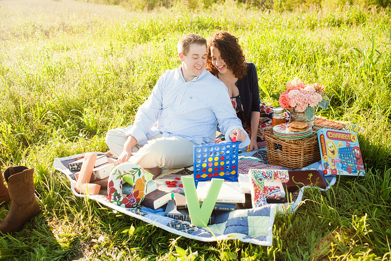 North Texas engagement portraits with a couple on a picnic playing games by Allison Davis Photography