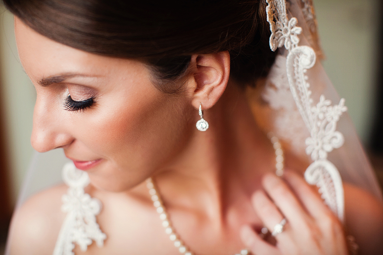 close up of a bride in her mother's veil at the stoneleigh hotel in downtown dallas