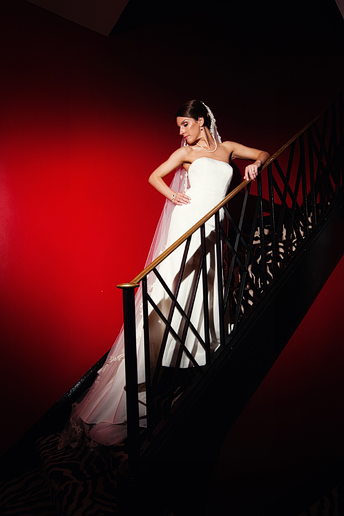 bridal portraits photographed at the Penthouse Suite red staircase at the Stoneleigh Hotel in downtown Dallas by North Texas wedding photographer Allison Davis Photography