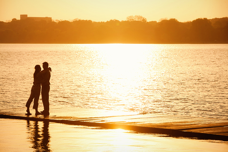 engagement portraits at White Rock lake at sunrise near the filter building by allison davis photography