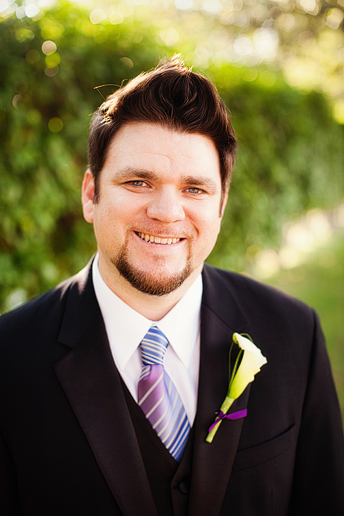 groom with lily boutonniere