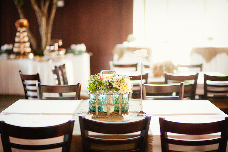 wedding day details of the rustic-inspired table centerpieces in wood boxes at Prestonwood