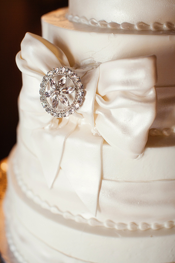 Dallas wedding day detail photographs of the Romano's Bakery wedding cake with jeweled bows