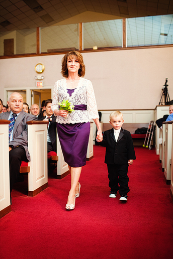 ring bearer down the aisle at a baptist Church wedding by Dallas wedding photographer Allison Davis
