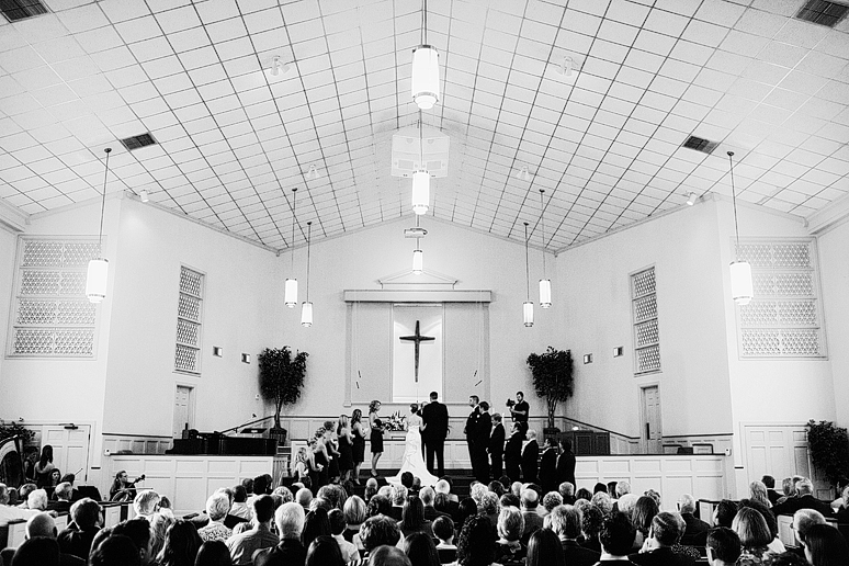 bride and groom wedding ceremony at baptist Church wedding by Dallas wedding photographer Allison Davis