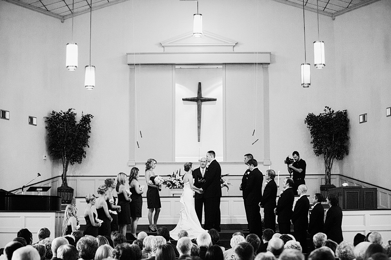 bride and groom wedding ceremony at baptist Church wedding by Dallas wedding
