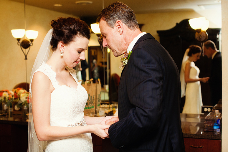 bride praying with her father on her wedding day in the bridal suite at Prestonwood Baptist Church by Dallas wedding photographer Allison Davis Photography