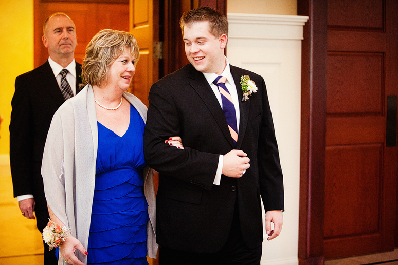 groom and mom walking down the aisle at Prestonwood Baptist Church wedding