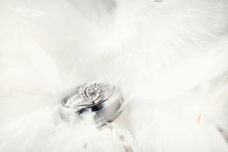 wedding rings insides of feather centerpieces