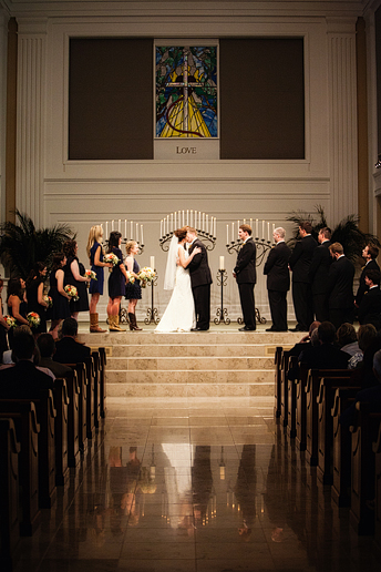 Prestonwood wedding ceremony bride and groom kiss in the chapel by Allison Davis