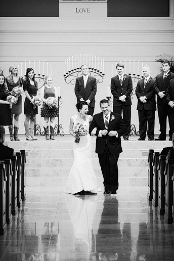 Prestonwood wedding ceremony bride and groom exit in the chapel by dallas wedding photographer
