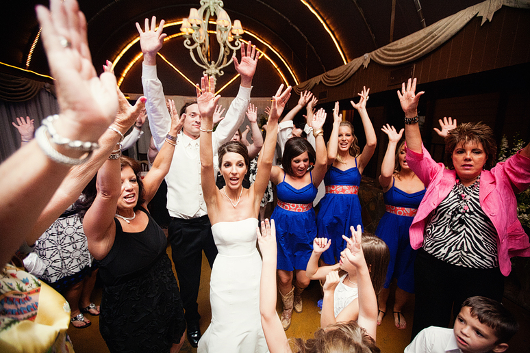 bridal party and guests dancing at a wedding reception at the downtown Dallas bed and breakfast hotel the Maple Manor