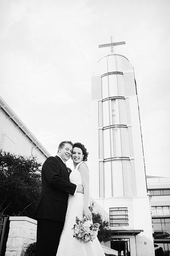 bride and groom portrait outside in front of the Prestonwood Chapel by Dallas wedding photographer Allison Davis