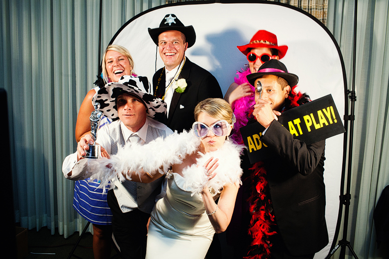 bride and friends at a photo booth at a wedding reception at a country club photographed by Dallas wedding photographer Allison Davis Photography