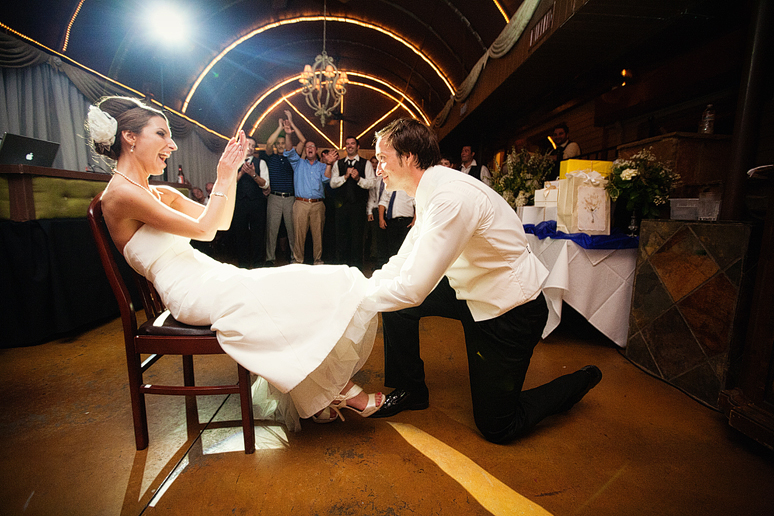 garter grab at the wedding reception at the downtown Dallas bed and breakfast hotel the Maple Manor