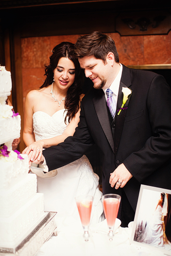 cutting the cake at a wedding reception at the canyon creek country club in Dallas Texas