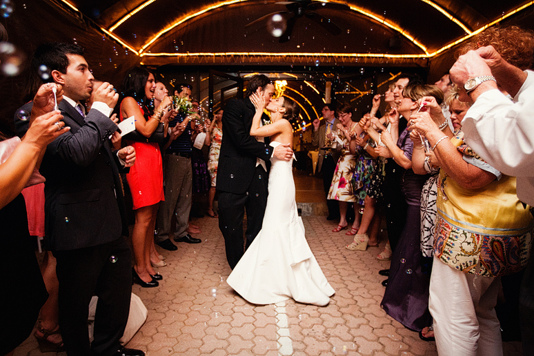 romantic grand wedding exit with bubbles from the Maple Manor Hotel by North Texas wedding photographer Allison Davis Photography