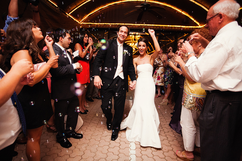grand wedding exit with bubbles from the Maple Manor Hotel by Dallas wedding photographer Allison Davis Photography