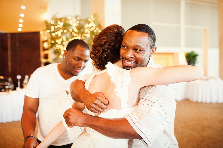 bride hugging guests at their wedding reception at Prestonwood Baptist Church by Plano wedding photographer Allison Davis
