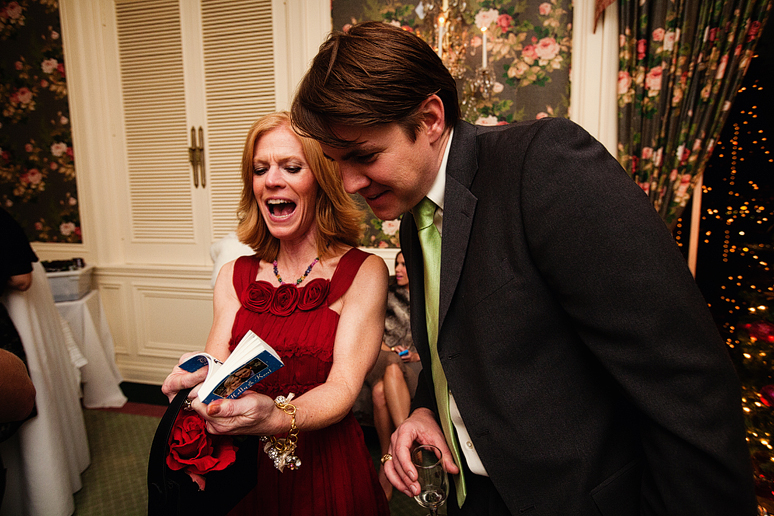 guests looking at Pic Flips books at a wedding reception
