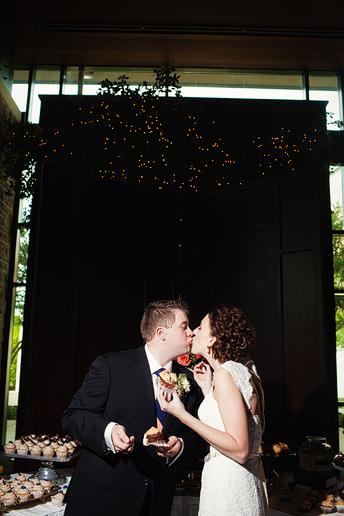 bride and groom cake cutting at their wedding reception at Prestonwood Baptist Church