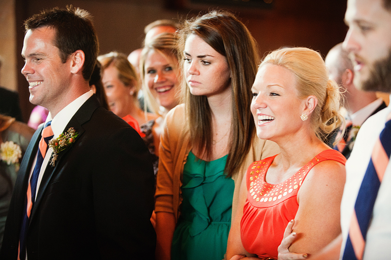 guests watching the cake cutting at their wedding reception at Prestonwood Baptist Church