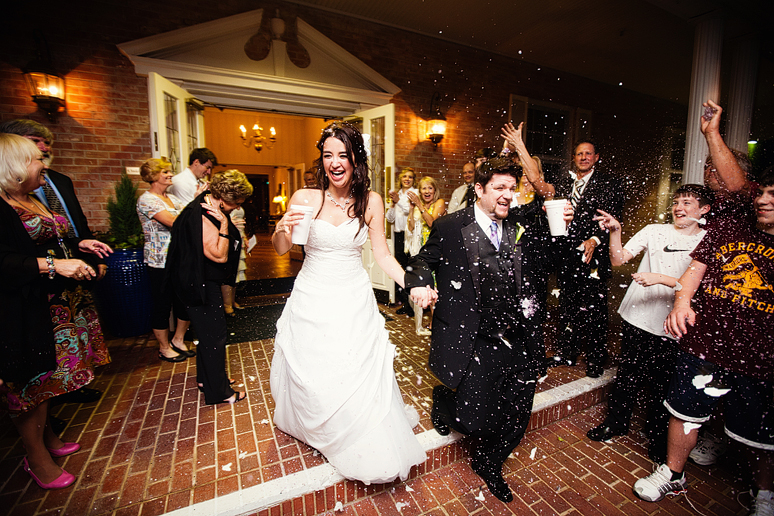 bride and groom wedding exit at the canyon creek country club with purple confetti