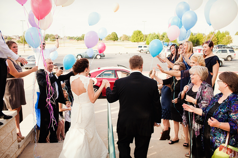 grand wedding exit with a balloon send off by Plano wedding photographer Allison Davis Photography