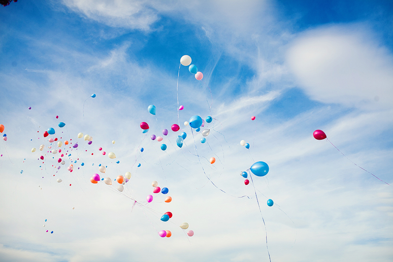 grand wedding exit with a balloon send off by Plano wedding photographer Allison Davis Photography