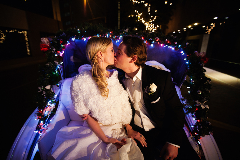 winter wedding exit in a horse-drawn carriage in downtown fort worth
