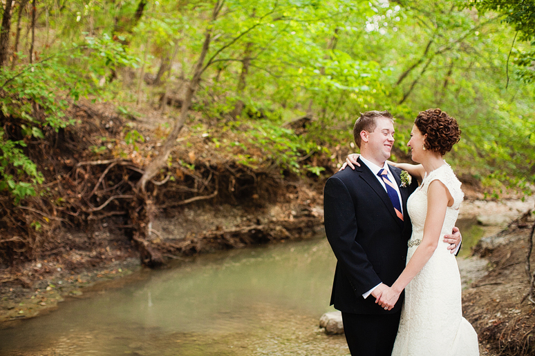 bride and groom portraits in a creek by Dallas wedding photographer Allison Davis