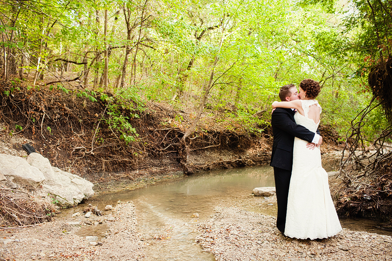 bride and groom portraits in a creek by Dallas wedding photographer Allison Davis