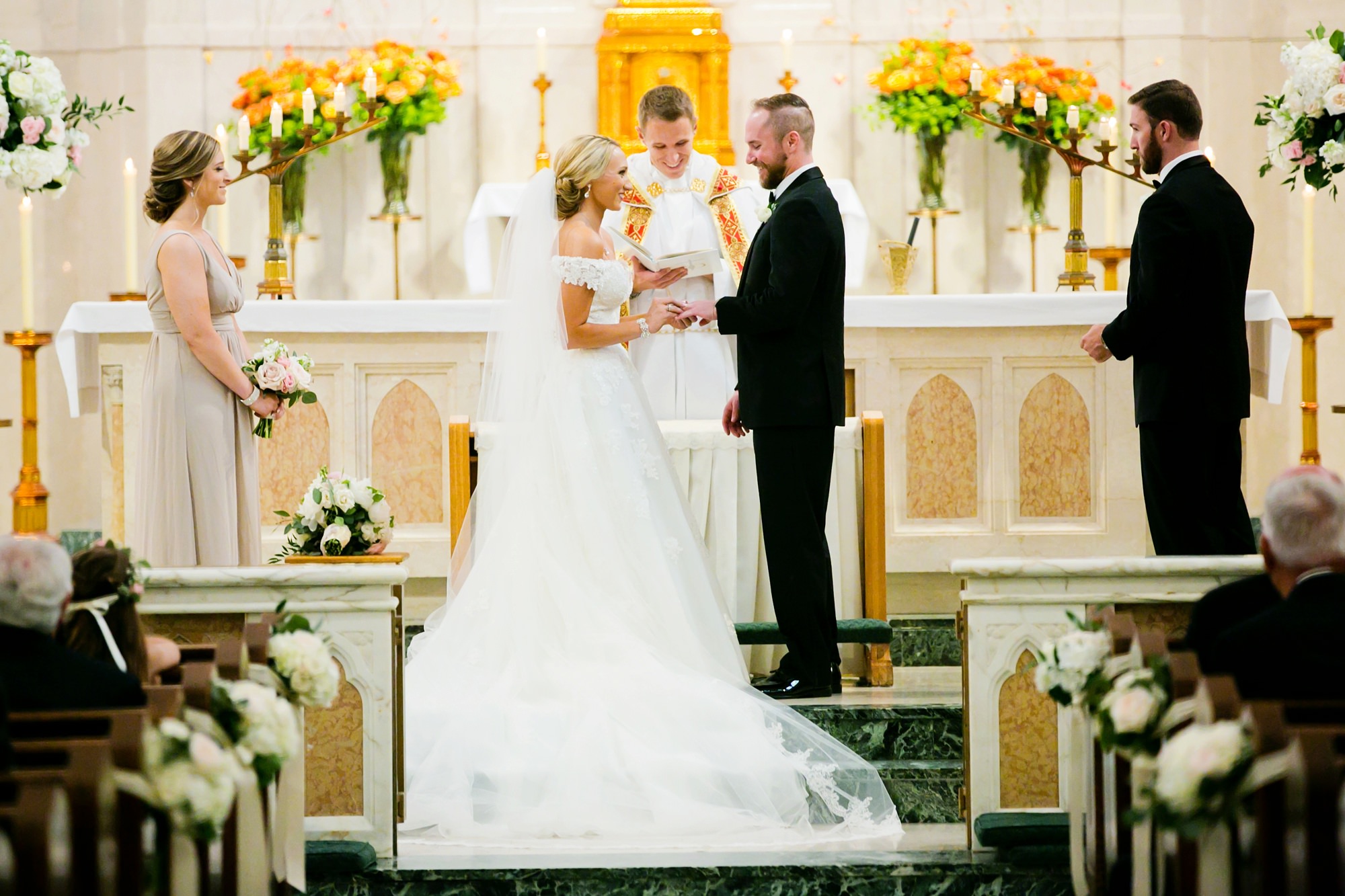 Wedding photographs during ceremony at St. Thomas Aquinas in Dallas