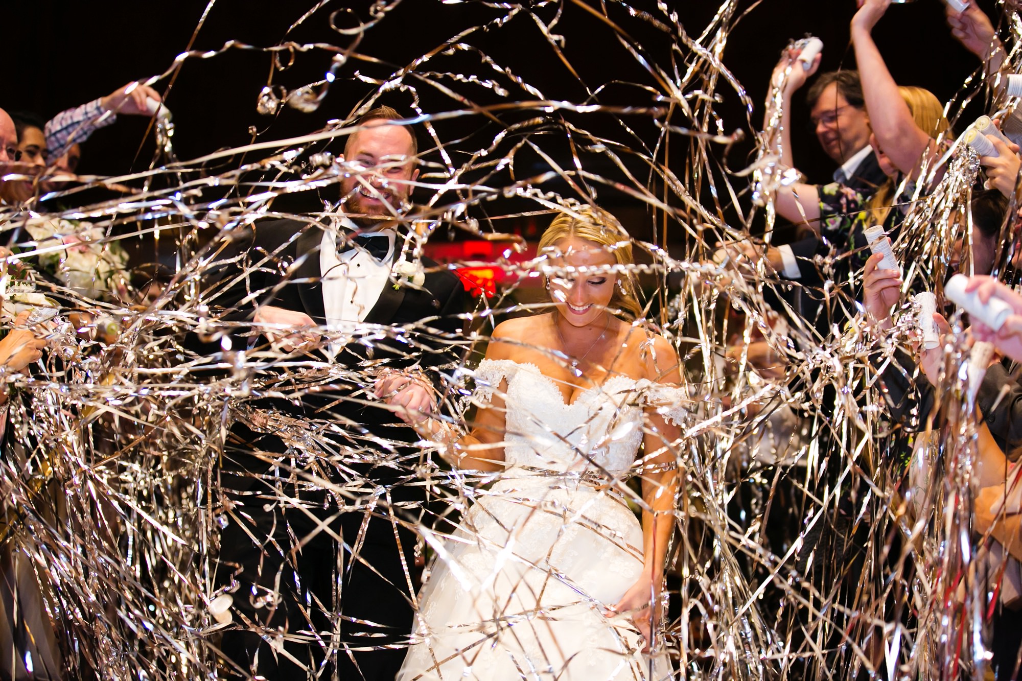 Wedding day exit with streamers in the Adolphus Hotel